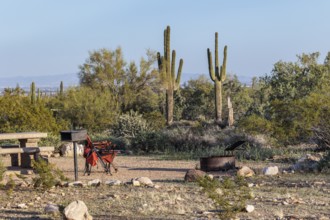 Camping chairs at a desert campsite at the White Tank Mountain Regional Park campground in Phoenix,