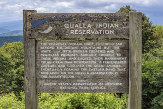 Sign along the Blue Ridge Parkway tells the origin of the Qualla Indian Reservation in the Smoky