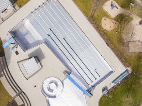 Aerial view of an empty swimming pool with clearly marked swimming lanes, renewal of the swimming