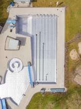 Aerial view of the swimming area with large lawn and surrounding green park, renewal of the