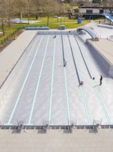 Bird's eye view of the swimming pool in a green area, renovation of the swimming lines, Calw