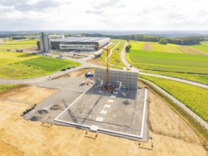 Extensive construction site in a rural area with construction vehicles and crane, ING Park