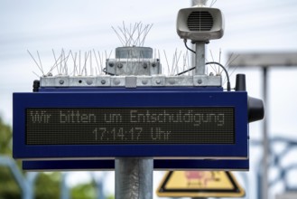 Display board, at a station, train cancellation announcement due to construction work, display