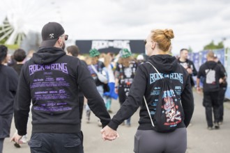 Two festival visitors with Rock am Ring jumpers at the Rock am Ring Festival on Friday, Nürburgring
