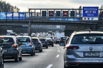 Driving on the A40 motorway, Ruhrschnellweg, in heavy traffic, drivers' perspective, Bochum, North