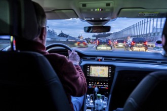 Driving on the A40 motorway, Ruhrschnellweg, in heavy traffic, drivers' perspective, Essen, North