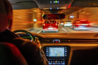 Driving on the A40 motorway, Ruhrschnellweg, in heavy traffic, driver's perspective, tunnel, Essen,