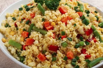 Couscous with vegetables, paprika, carrots, string beans, corn, homemade, top view, no people