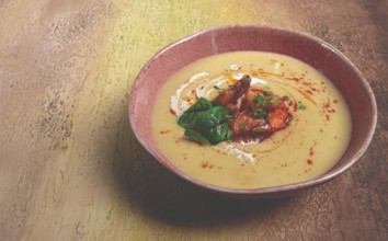 Pumpkin cream soup with shrimp, herbs and spices, homemade, no people
