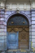 Wooden entrance portal with a 19th century residential building, Medias, Romania
