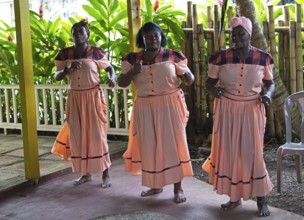 Guatemalan woman in traditional clothing singing and dancing, Garifuna people, Livingston, Izabal