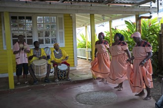 Guatemalan men playing traditional music and woman dancing, Garifuna people, Livingston, Izabal