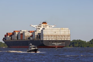 Container ship Istanbul Express sails up the Elbe towards the Port of Hamburg, shipping on the