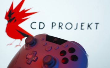 Dhaka, Bangladesh- 20 Mar 2025: A close-up of a gamepad with the CD Projekt seen on screen in the