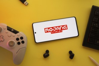 Dhaka, Bangladesh- 23 March 2025: Mojang Studios logo displayed on a smartphone surrounded by