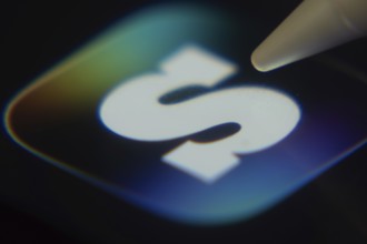 Dhaka, Bangladesh- 06 Dec 2025: Close-up of the SCRUFF app on a screen with a stylus pointing at it