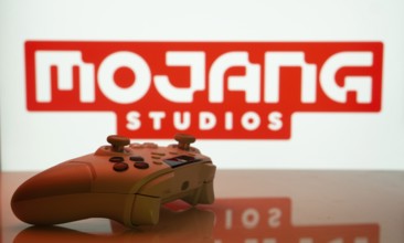 Dhaka, Bangladesh- 20 Mar 2025: A close-up of a white gamepad with the Mojang Studios seen on