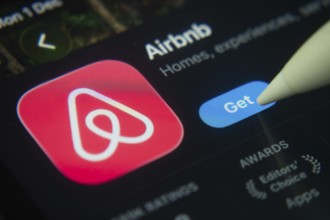 Dhaka, Bangladesh- 01 Dec 2025: A close-up of the Airbnb app icon in the App Store on an iPad
