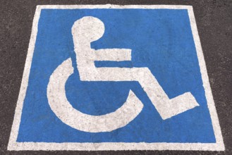 Parking space marked in blue for disabled people, Romania