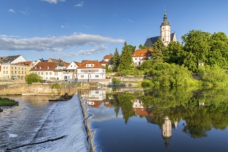 City view with church of Our Lady on the mountains and reflection in Zwickauer Mulde, Staustufe,