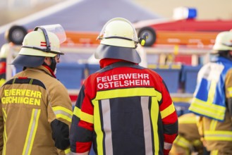 Several firefighters in protective clothing on duty, fire brigade exercise on the Hermann Hesse