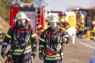 Firefighters during an emergency operation with full protective clothing and respiratory