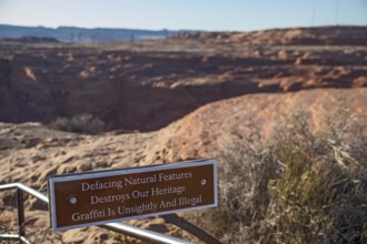 Page, Arizona - A sign at a viewpoint for the Glen Canyon Dam asks visitors to refrain from placing