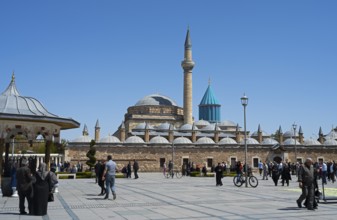 View of a mosque with several domes and minarets under a blue sky, Mevlana Museum, Mevlana,