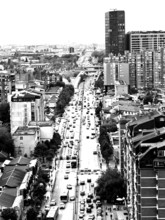 City view of a busy street with skyscrapers in the background in black and white, Pristina, Kosovo