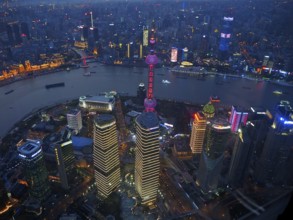 View of illuminated skyscrapers and river at night, Shanghai, China