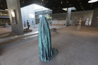 Statue of a veiled figure in the Lehmbruck Museum, self-portrait as a ghost by sculptor Alicja