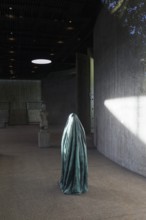Statue of a veiled figure in the Lehmbruck Museum, looking through window, self-portrait as a ghost