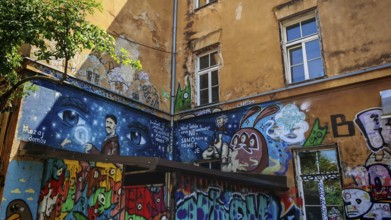 Colourful graffiti on an old building wall with windows and urban atmosphere, Ljubljana, Slovenia