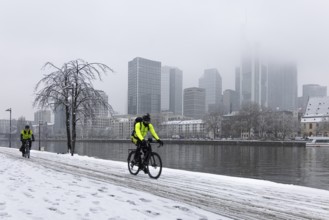 Clouds envelop Frankfurt's banking skyline. Heavy snowfalls have caused another onset of winter in