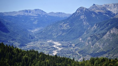 View of a mountain valley with a river surrounded by forests and mountains, Peaks of the Balkans,