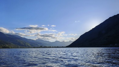 View of a lake with mountains in the background and a clear blue sky, Plav Lake, Montenegro