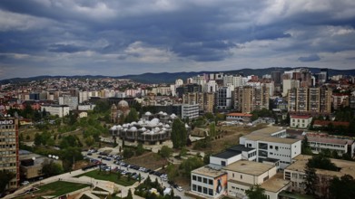 Urban landscape with modern architecture under cloudy sky, Pristina, Kosovo