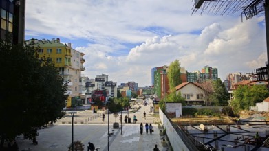 City view with modern buildings, under a cloudy sky, Pristina, Kosovo