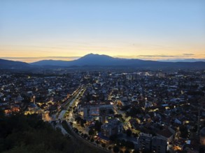 City view at sunset with bright sky and illuminated roads, Prizren, Kosovo