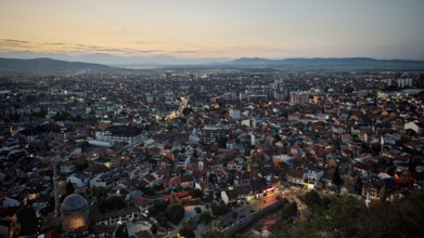 Extensive night view over the city with illuminated roads and hills, Prizren, Kosovo