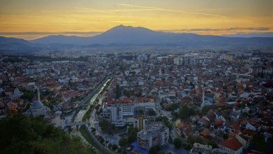 City view at sunset, illuminated roads and mountains in the background, Prizren, Kosovo
