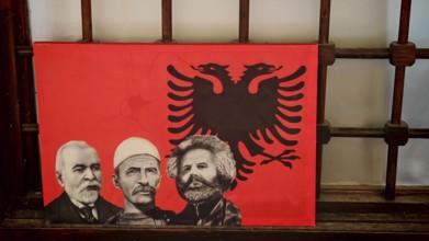Red picture with three portraits and an Albanian eagle, Kosovo