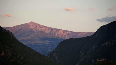 Mountain landscape in evening light with cloudy sky and rolling hills, Prizren, Kosovo