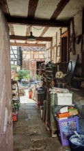 View of a rustic courtyard full of old tools and objects, Upper Franconia