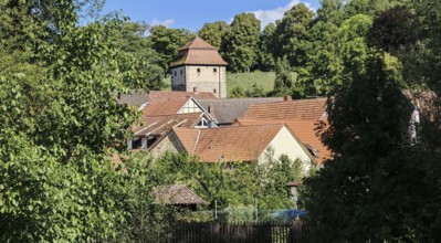 Charming village with historic tower, nestled in green countryside, Upper Franconia