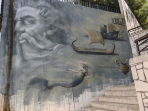 Imaginative wall painting with mythological figures such as mermaid and antique ship, Montenegro