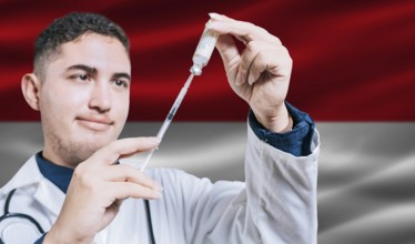 Doctor holding syringe on Monaco flag background. Medical professional holding syringe with