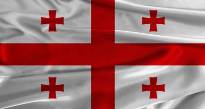 Flag of Georgia with fabric textured background. Close up of National flag of Georgia with