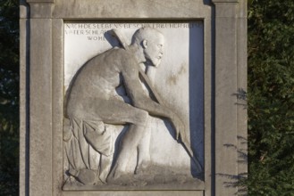 Grave relief old man with walking stick, Nordfriedhof Düsseldorf, North Rhine-Westphalia, Germany