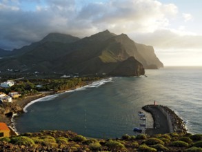 Coastal region with port and lighthouse, surrounded by mountains and sea, Puerto de la Aldea, Gran